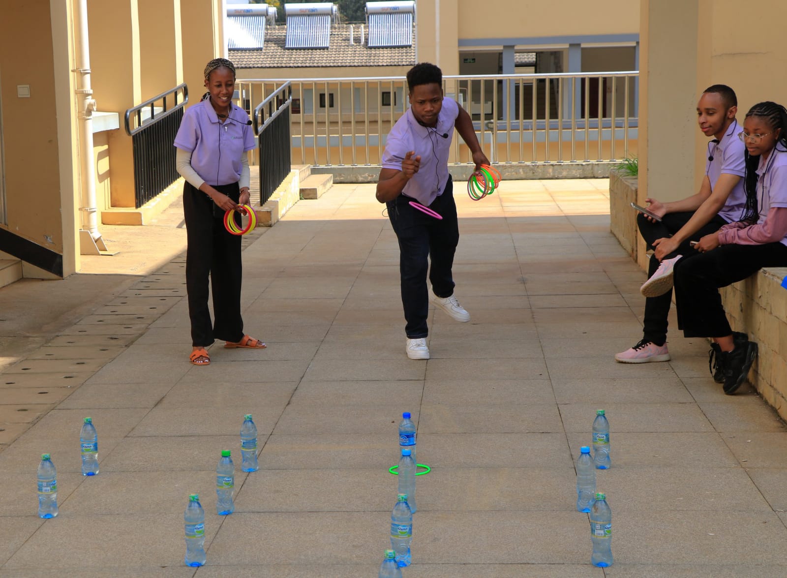 CIUoN student Volunteers demonstrating how to play the Ring Toss game to Freshmen on the 2024 Open day.