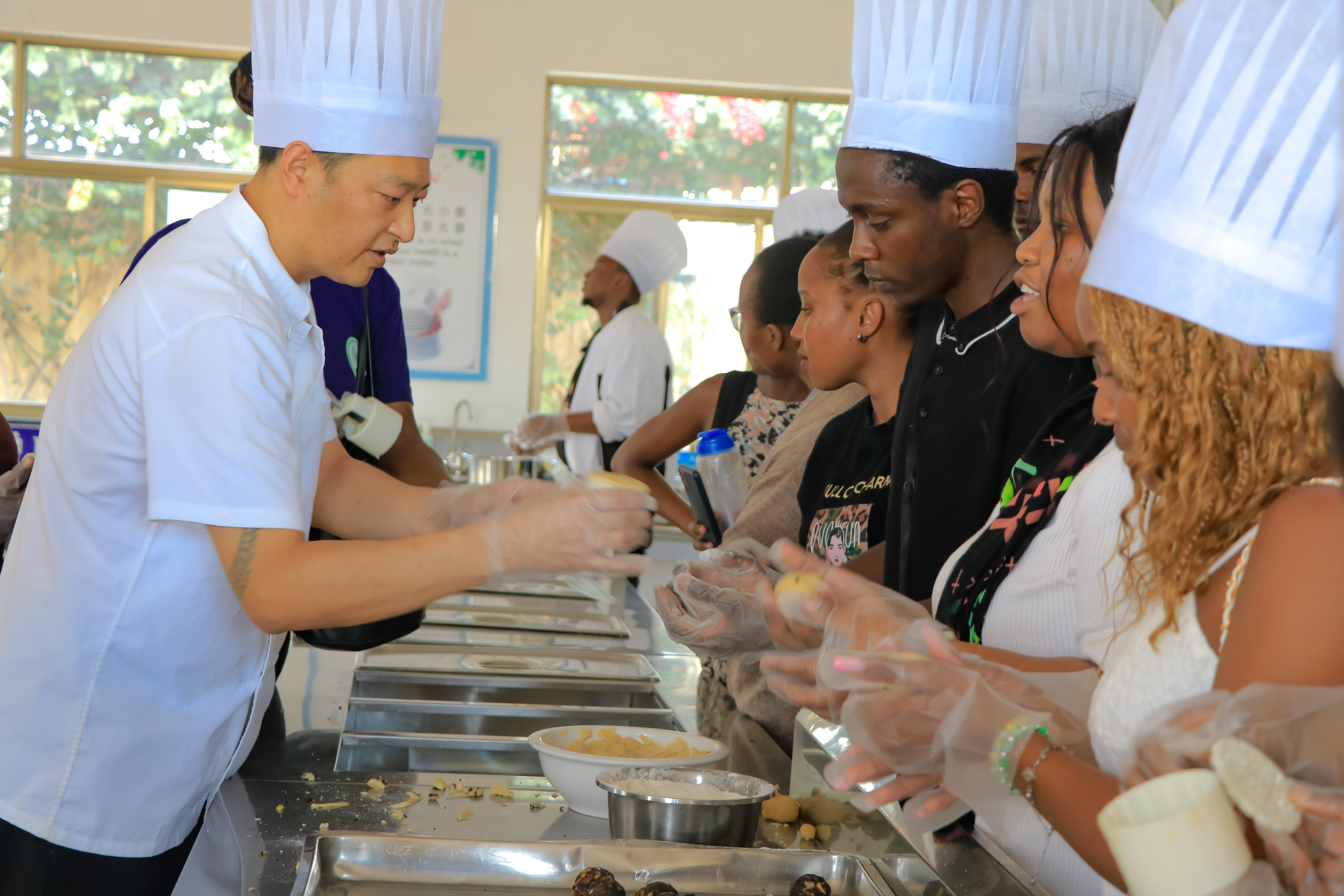 CIUoN students are taught how to make Chinese Moon Cakes by an Afristar Chinese Chef.