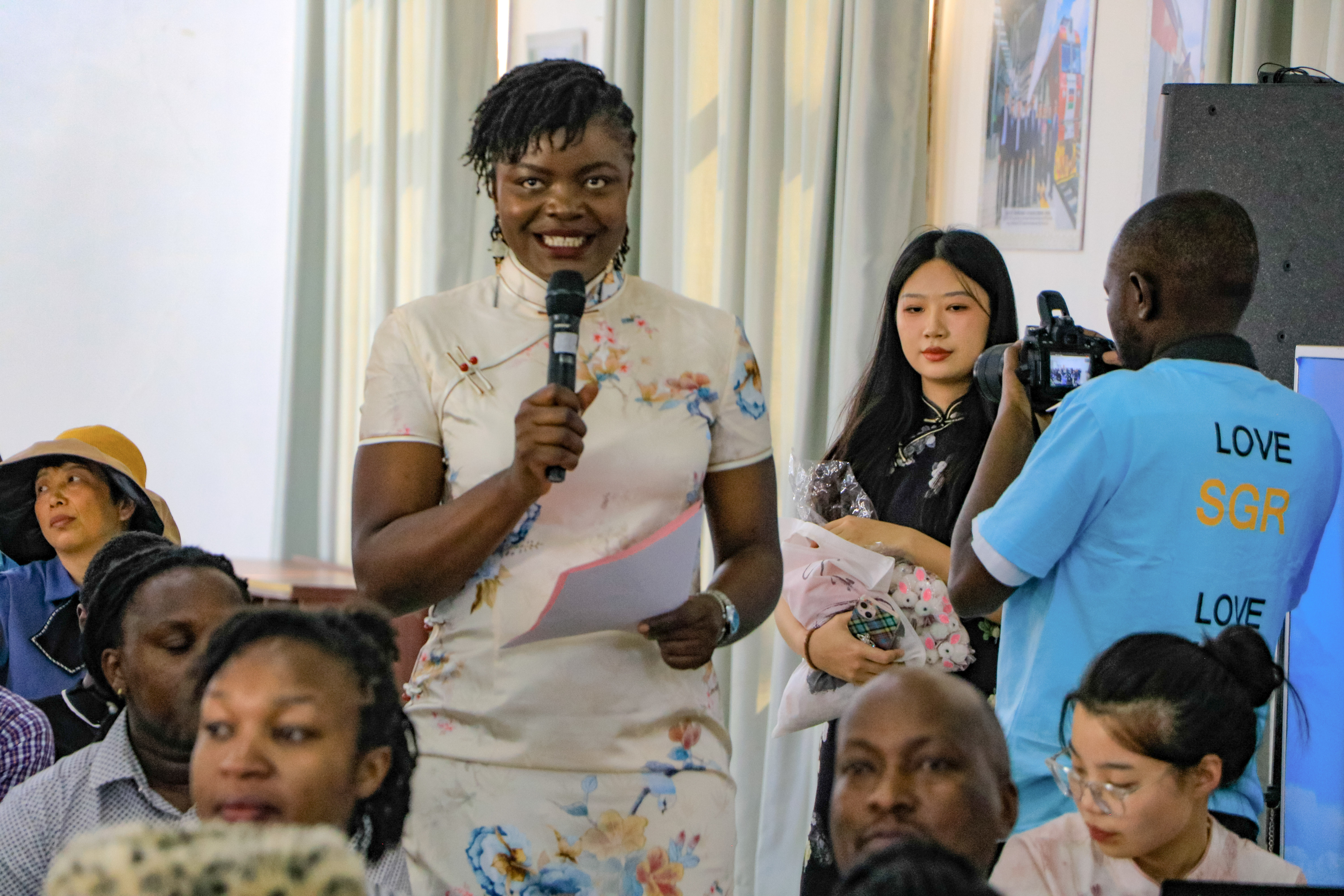 Teacher Maureen Ooko Moderating CIUoN  Students's Performances in Afristar's Multifunction Room